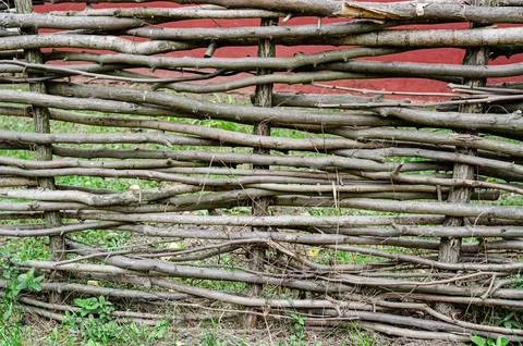 Fence made of tree branches boards Stock Photos