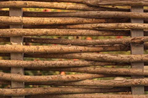A fence made of wicker branches of a willow tree. Foto stock