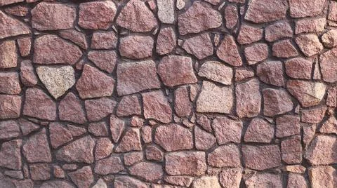 Fence masonry. Rubble stone. Texture Stock Photos