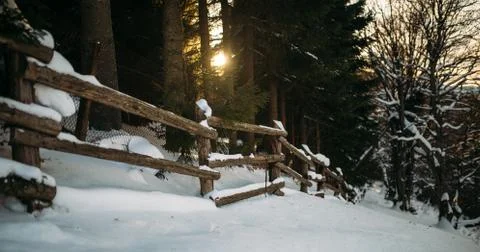 Fence in the mountains at sunset Stock Photos
