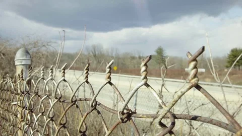 Fence next to highway Stock Footage 72330501