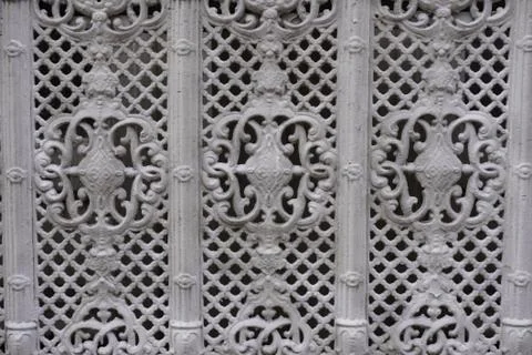 Fence paint in white with an artistic pattern. Фото