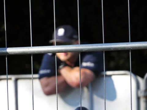 Fence with Policeman in Background during Protests in front of Polish Senate  Stock Photos