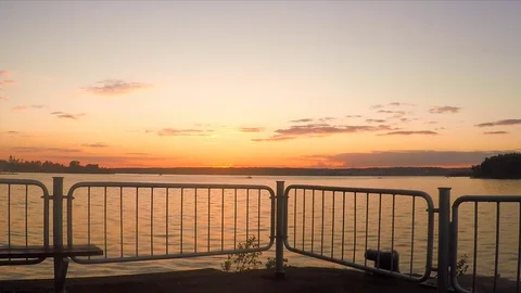 Fence on the pond at sunset in summer 動画素材 82371049