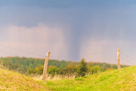 Fence post and cloudy sky Stock Photos