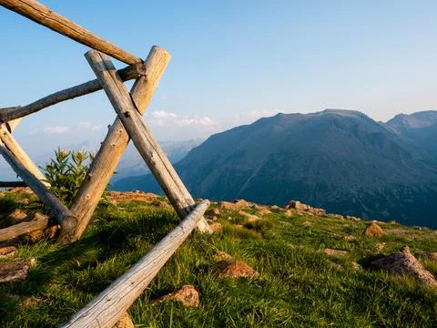 Fence posts at the edge of a cliff in the Rocky Mountains. Stock Photos