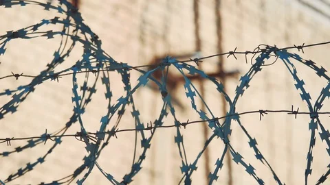 Fence prison closed area strict regime silhouette barbed wire. illegal Stock Footage 101590532
