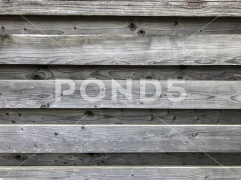 Fence from raw boards. Stock Photos