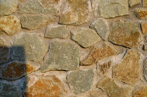 Fence real stone wall surface with cement as background. Pattern Vintage Co.. Stock Photos