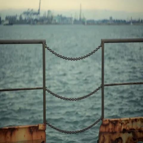 The fence of rusted chains at the port Stock Footage 69534843