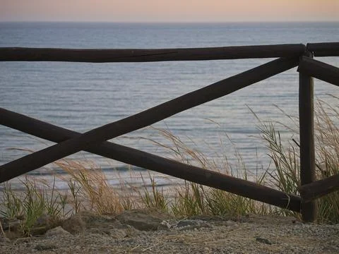 Fence at the sea Stock Photos