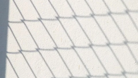 Fence shadow is moving on the wall, outdoor  Chiangmai  Thailand Stock Footage 167755300