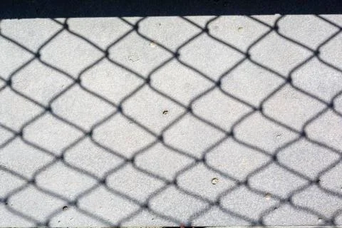 Fence shadow 스톡 사진