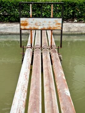 The fence with sign on the rusty pipe Foto stock