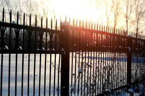 Fence with spikes sun Foto stock