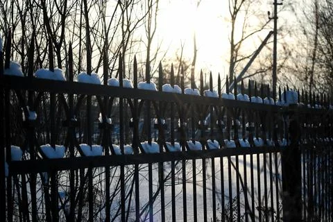 Fence with spikes sun Foto stock
