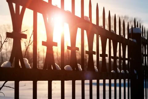 Fence with spikes sun Foto stock