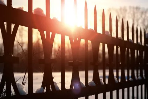 Fence with spikes sun Foto stock