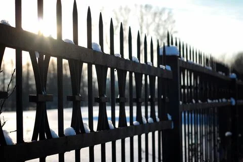 Fence with spikes sun Foto stock