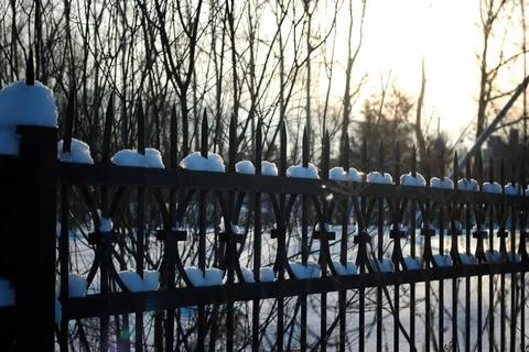 Fence with spikes sun Foto stock