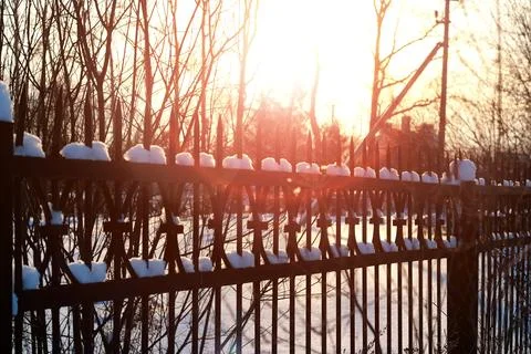 Fence with spikes sun Foto stock