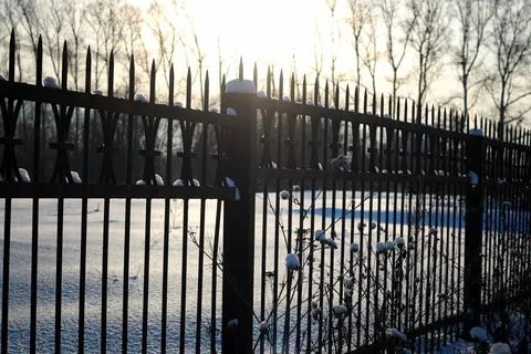 Fence with spikes sun Foto stock