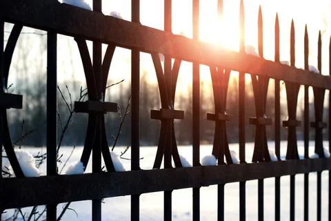 Fence with spikes sun Foto stock