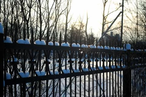 Fence with spikes sun Foto stock