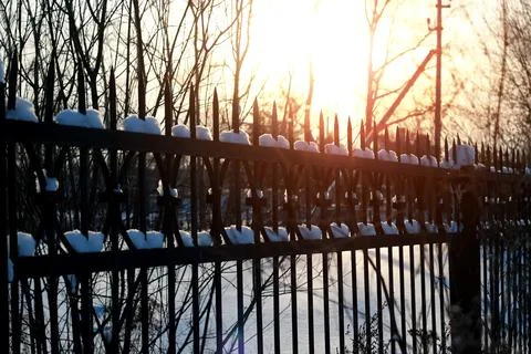 Fence with spikes sun Foto stock