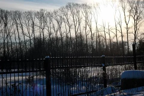 Fence with spikes sun Foto stock