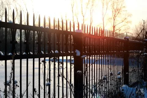 Fence with spikes sun Foto stock