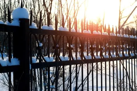 Fence with spikes sun Foto stock