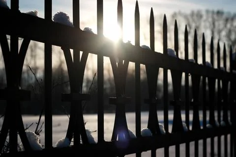 Fence with spikes sun Foto stock