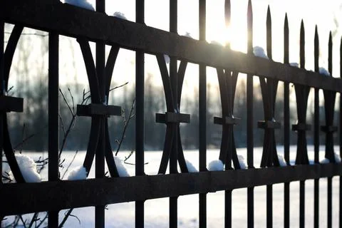 Fence with spikes sun Foto stock