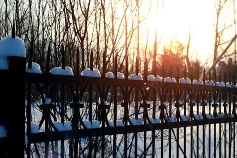 Fence with spikes sun Foto stock