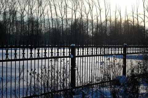 Fence with spikes sun Foto stock