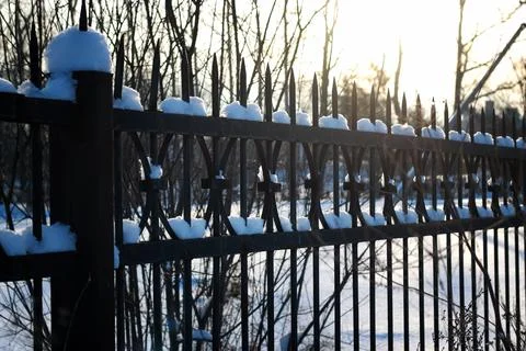 Fence with spikes sun Foto stock