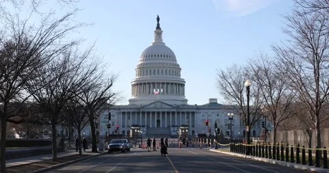 A fence surrounds the U.S. Capitol building after the Jan. 6 riots Stock Footage 146348093