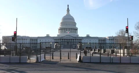 A fence surrounds the U.S. Capitol building after the Jan. 6 riots Video stock 146348609