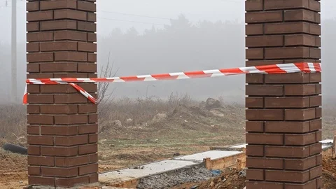 Fence tape between two brick columns. Stock Footage 120812729