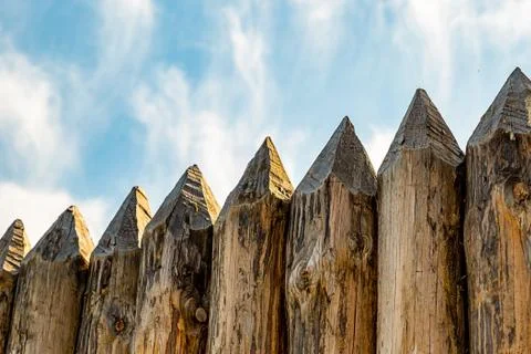 Fence traditional pointed logs parallel protection of the fort europe outdoor Stock Photos