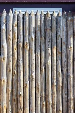 Fence from trunks of trees Stock Photos