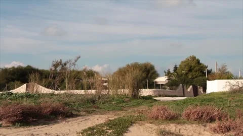 Fence villa beachside sicily italy trees daytime pan right to left Stock-Footage 252152304