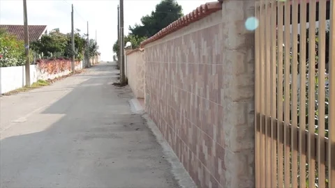 Fence villa beachside sicily italy street road movement left to right Stock Footage 252152330