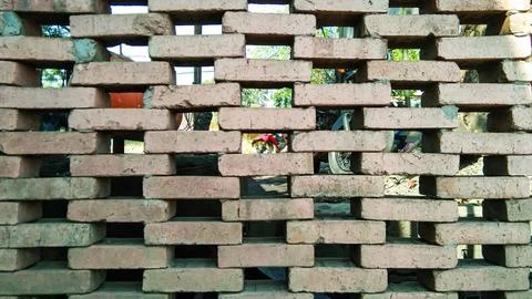 The fence wall is made of bricks, very aesthetic Stock Photos
