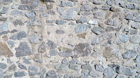 Fence, a wall of small granite stone and cement Stock Footage 124167389