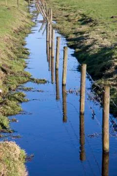 Fence in water Stock Photos