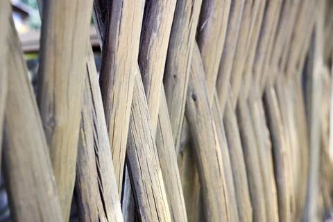 Fence wicker made of hazel rods. Organic woven hazel wicker fence rural style. Stock Photos