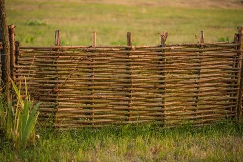 Fence wicker from the vine, texture, background. Wicker vine fence. woven vin Stock Photos