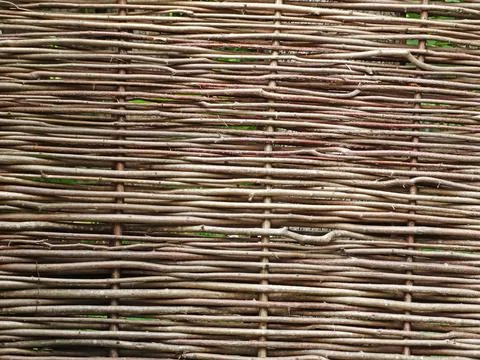Fence wicker from the vine, texture, background. Wicker vine fence. woven vin Stock Photos